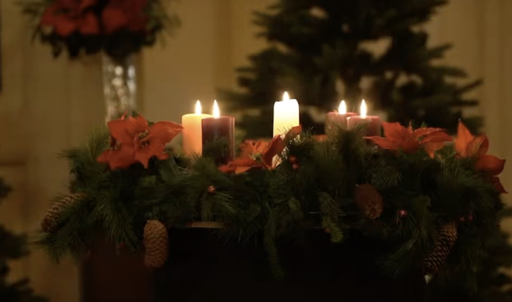 Christmas candles inside a church, lit for service.