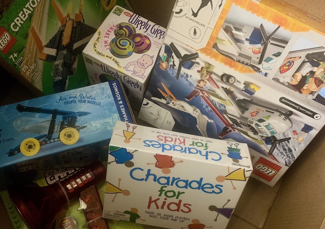 photo of a variety of children's toys in a donation box