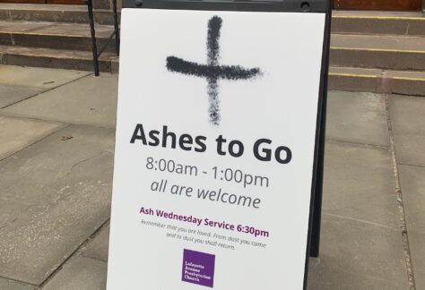 Sign in front of church building with text "Ashes to Go"