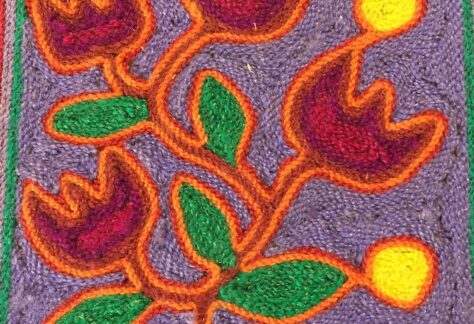 piece of art created with yarn, four flowers